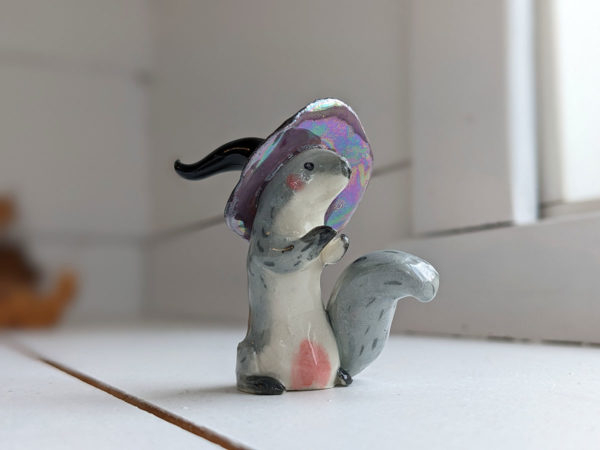 porcelain witch squirrel figurine