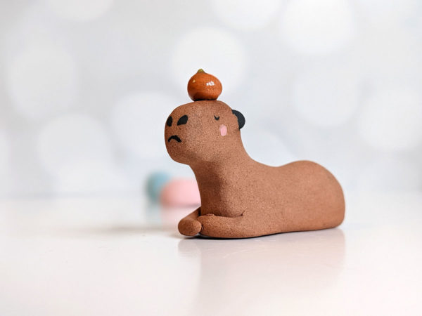 red clay capybara orange figurine