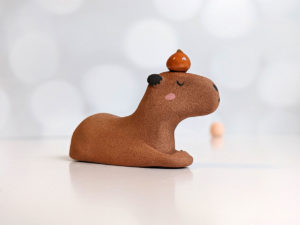 red clay capybara orange figurine