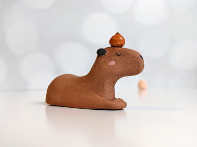 red clay capybara orange figurine
