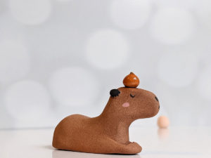 red clay capybara orange figurine