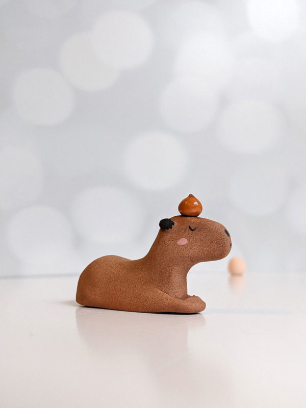 red clay capybara orange figurine