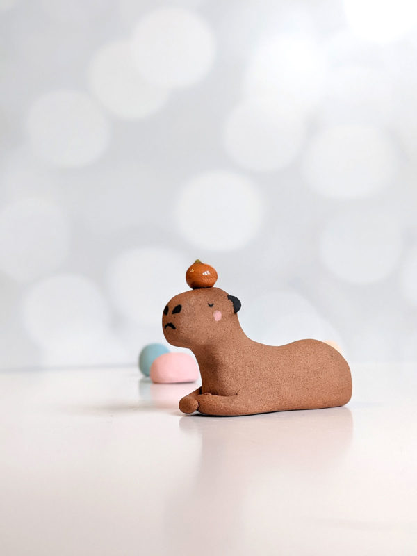 red clay capybara orange figurine