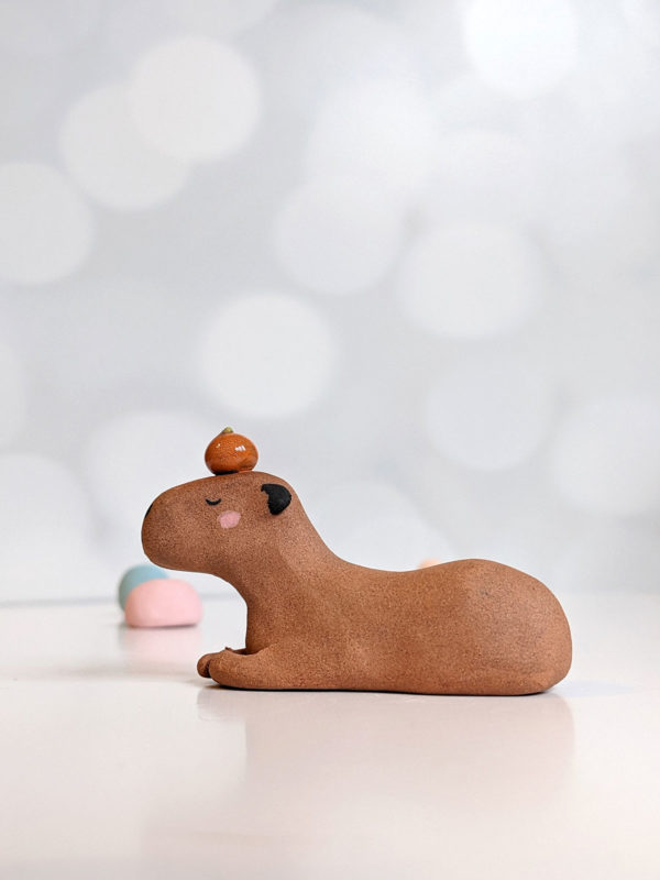 red clay capybara orange figurine