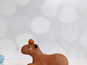 red clay capybara orange figurine