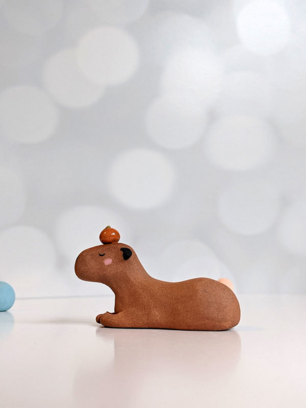 red clay capybara orange figurine