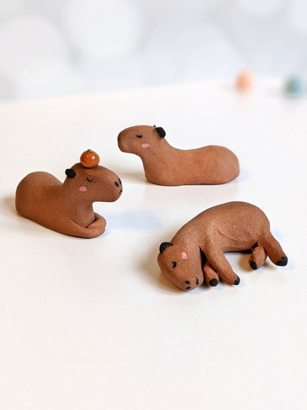 red clay capybara figurines group