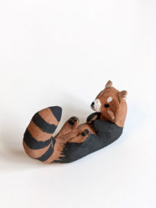red clay ceramics figurine red panda holder