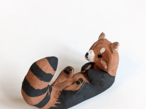 red clay ceramics figurine red panda holder