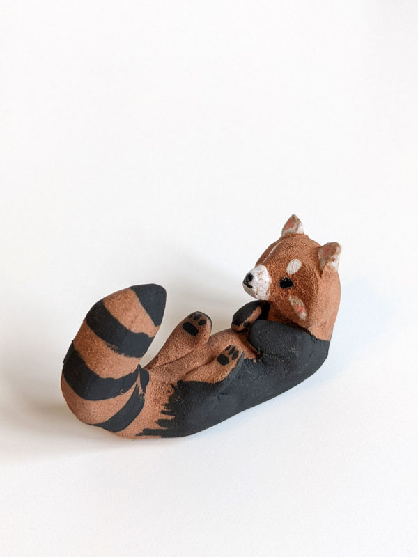 red clay ceramics figurine red panda holder