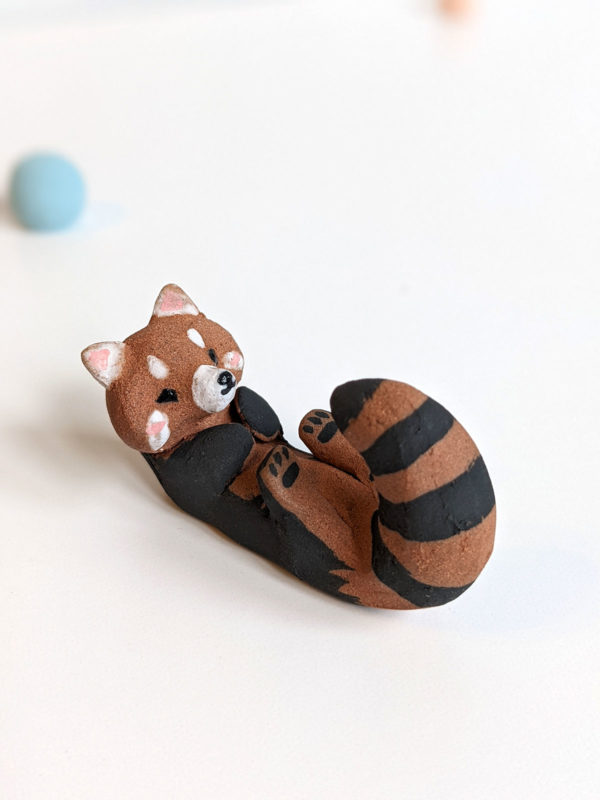 red clay ceramics figurine red panda holder