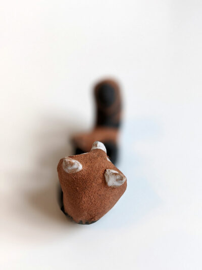 red clay ceramics figurine red panda holder