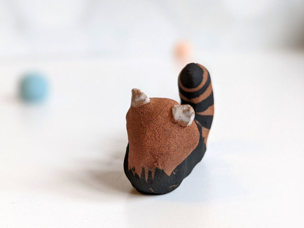 red clay ceramics figurine red panda holder