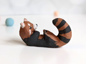 red clay ceramics figurine red panda holder