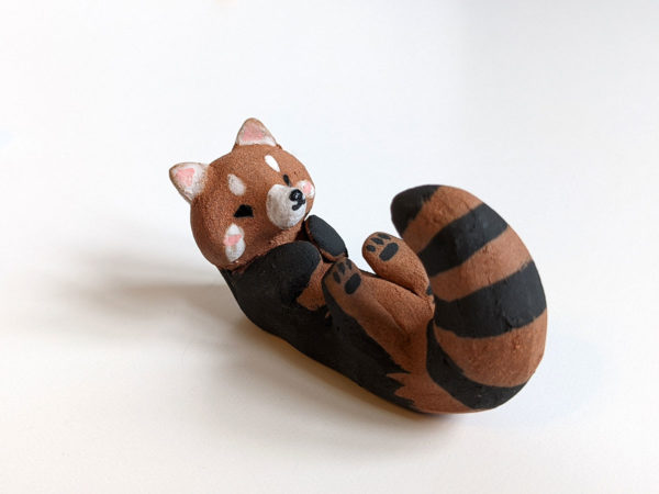 red clay ceramics figurine red panda holder