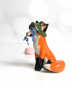 Fox figurine with fishing gear
