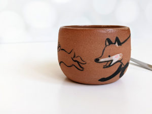 handmade fox hare red clay cup