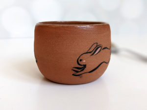 handmade fox hare red clay cup