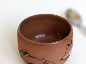 handmade fox hare red clay cup