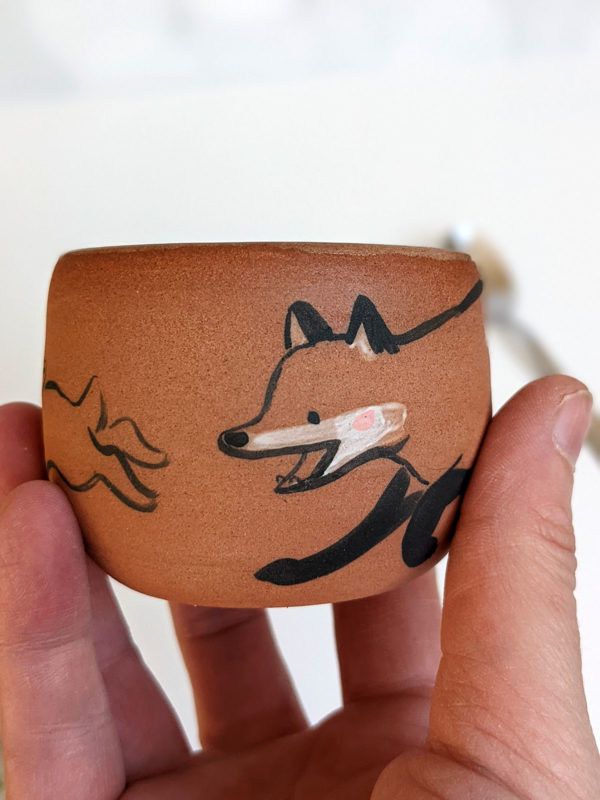 handmade fox hare red clay cup