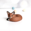 red fox in red clay figurine