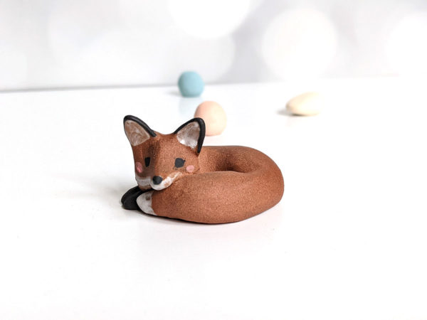 red fox in red clay figurine