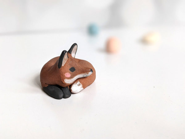 red fox in red clay figurine