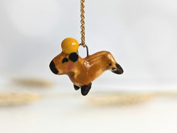handmade porcelain pendant capybara orange