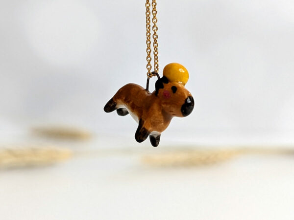 handmade porcelain pendant capybara orange