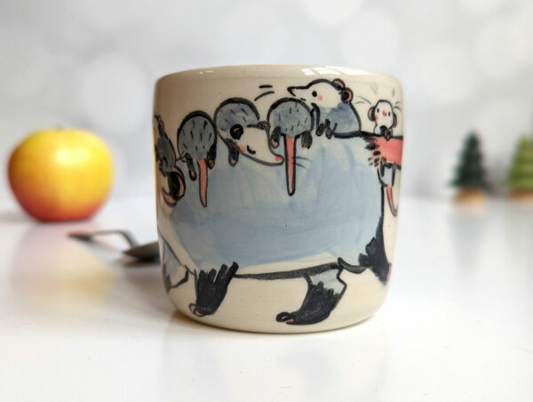 opossum family stoneware cup
