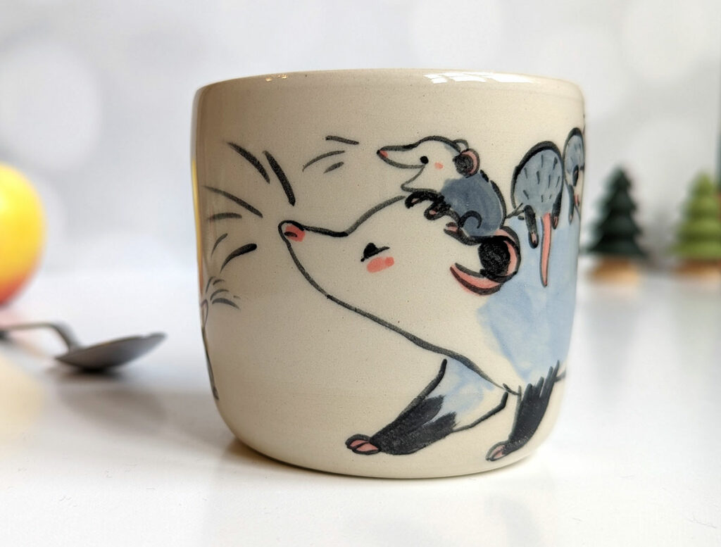 opossum family stoneware cup