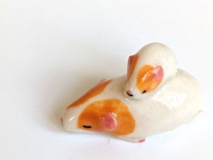 guinea pig and kid figurine porcelain