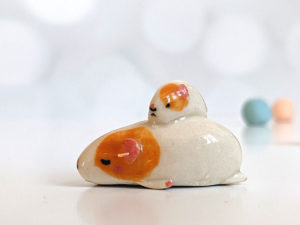 guinea pig and kid figurine porcelain