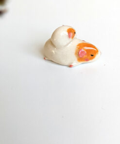 guinea pig and kid figurine porcelain