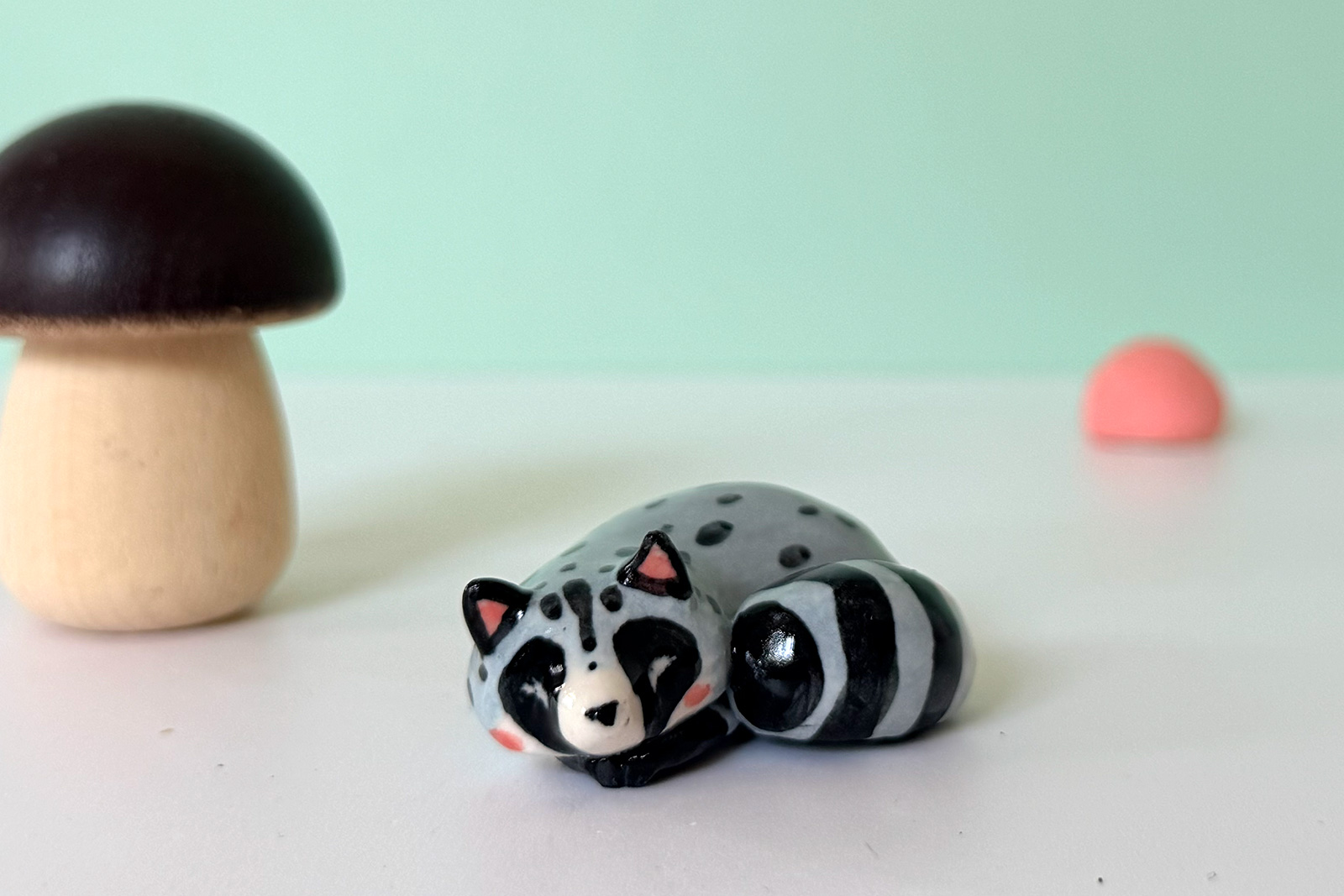 Porcelain Figurine - Sleepy Raccoon