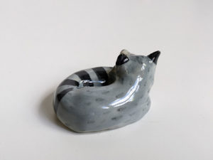 leepy raccoon porcelain figurine
