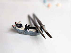 porcelain raccoon chopstick holder