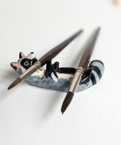 porcelain raccoon chopstick holder