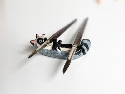 porcelain raccoon chopstick holder