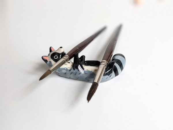 porcelain raccoon chopstick holder