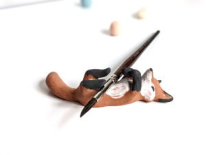 red fox brush holder red clay figurine