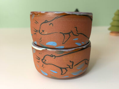 cute otter tumbler handmade in red clay kness