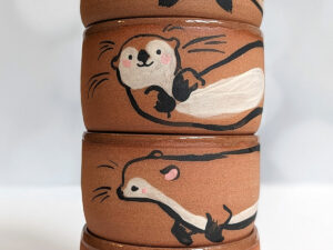 cute otter tumbler handmade in red clay kness