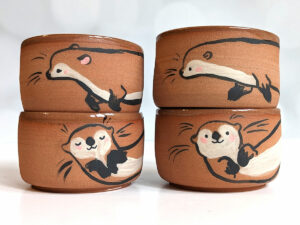 cute otter tumbler handmade in red clay kness