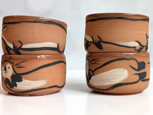 cute otter tumbler handmade in red clay kness