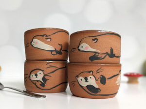 cute otter tumbler handmade in red clay kness