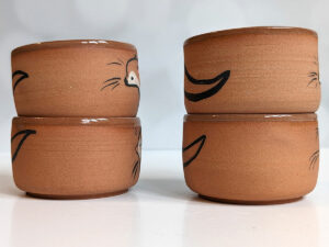 cute otter tumbler handmade in red clay kness