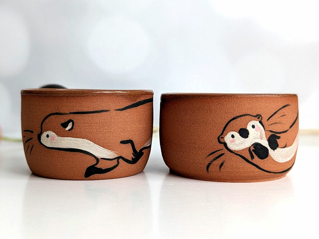 cute otter tumbler handmade in red clay kness