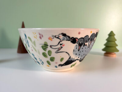 cute handmade porcelain bowl with an opossum family