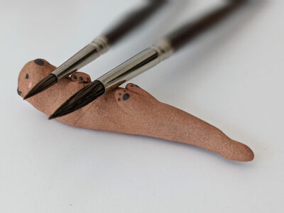 ceramic otter brush rest